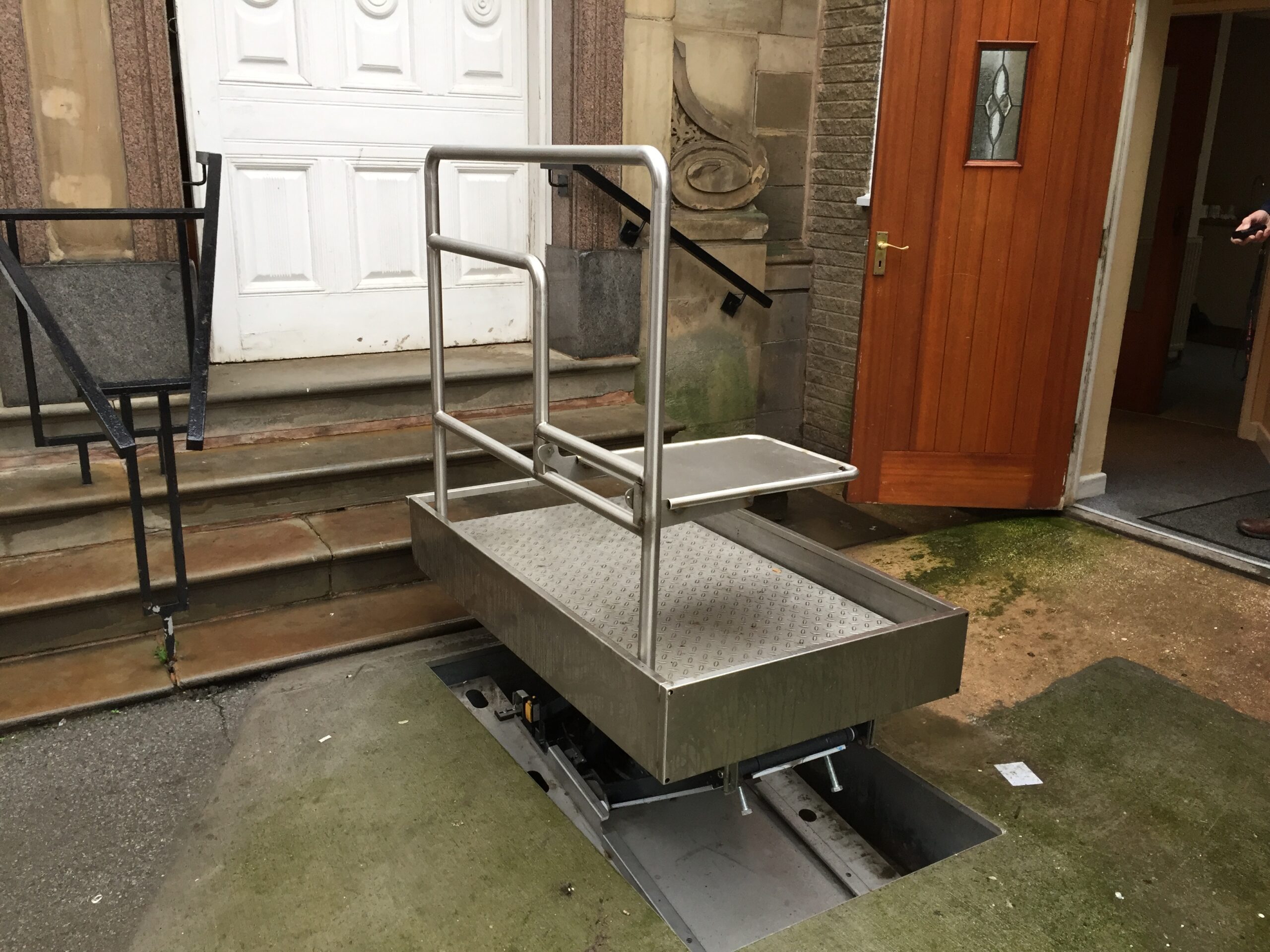 Installation with handrail and folding seat