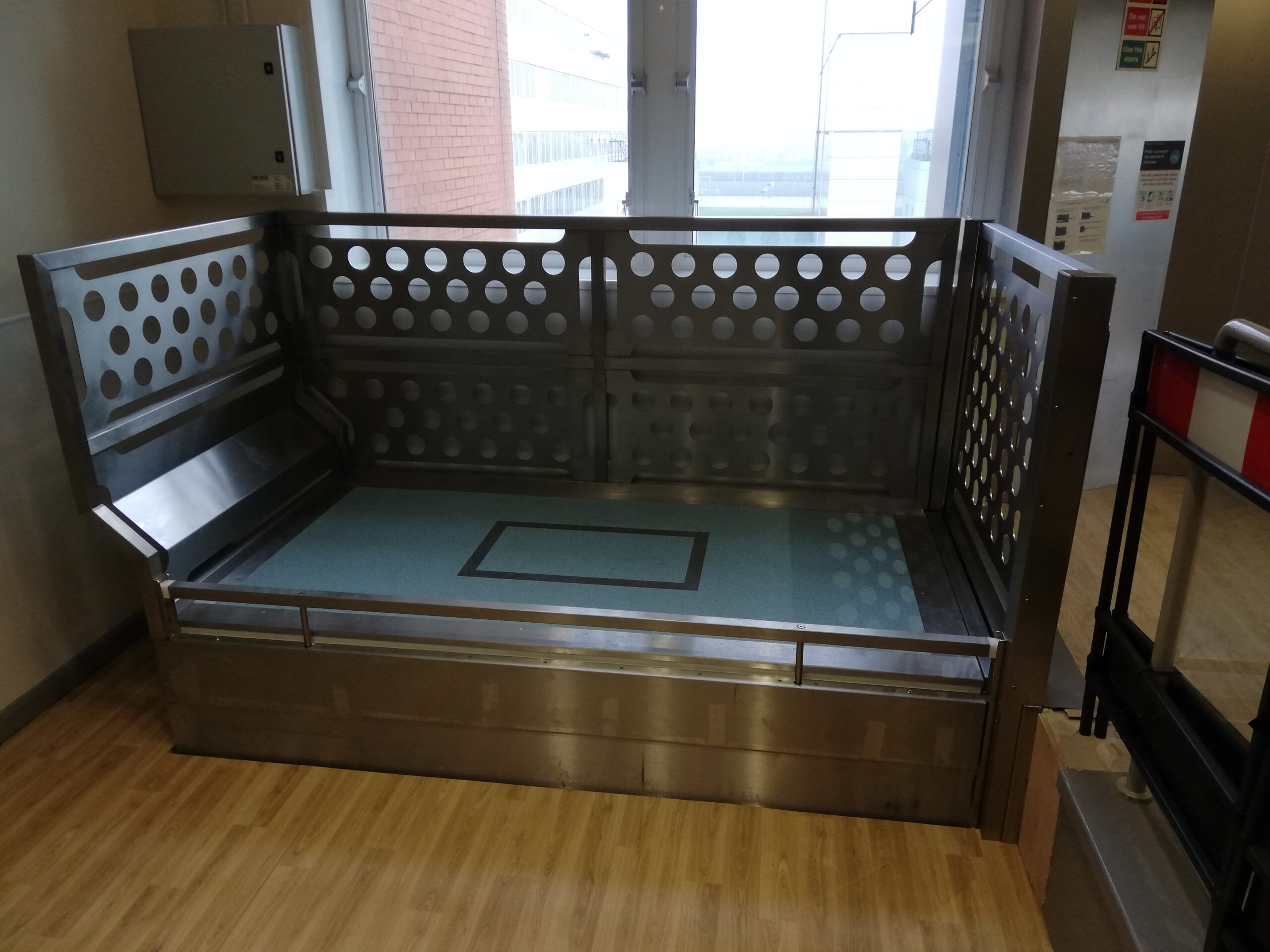 Hospital bed with adjacent entry/exit